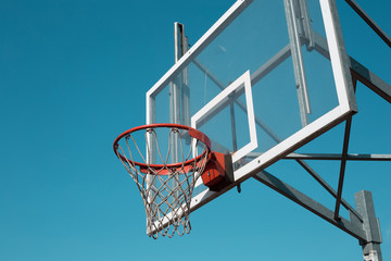 Basketball hoop outdoor on blue sky background - sports