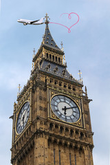 Fototapeta na wymiar Big Ben, close-up of the popular London landmark, with airplane as travel concept 
