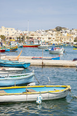 Obraz premium Traditional colorful fishing boats at Marsaxlokk Harbor, Malta
