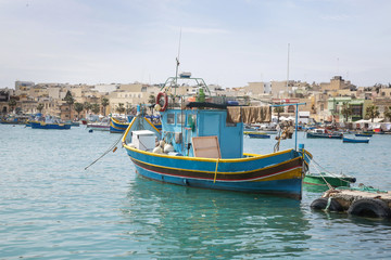Traditional colorful fishing boats at Marsaxlokk Harbor, Malta