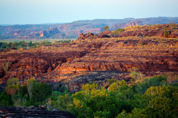 Panoramic view of colorful rock formation at beautiful sunset light in Australian Kakadu park.