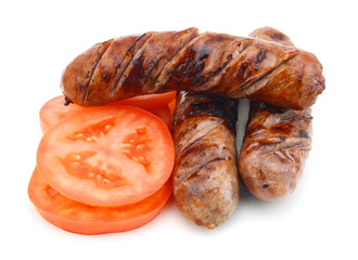 Frie sausage and slice tomato on white