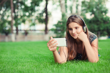 Serious girl looking interested at phone to the message she received