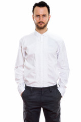 Fototapeta premium Young handsome bearded man doctor