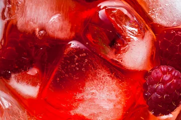 Fotobehang closeup photo of raspberries drink with ice . red macro food background © irinagrigorii