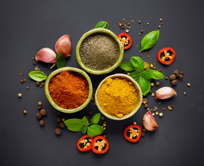 various spices on black background