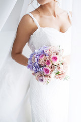 Wedding bouquet of the bride in hand. Beautiful wedding bouquet for bride