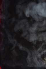 smoke and fog. black background. hookah and cigarettes