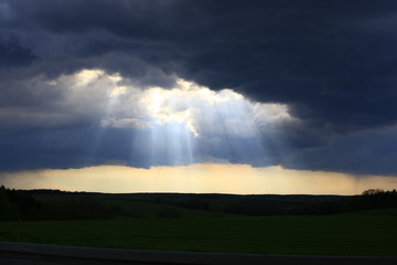 Fototapeta na wymiar Clouds and sunrays