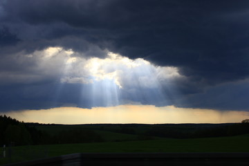 Fototapeta na wymiar Clouds and sunrays