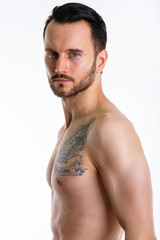 Fototapeta premium Young handsome bearded man shirtless