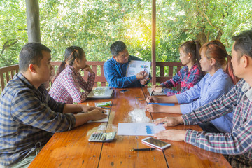 Managers are explaining the graph to the team.