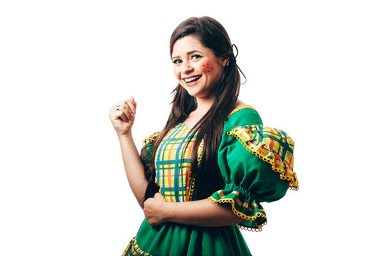 Brazilian woman dancing and wearing typical clothes for the Festa Junina
