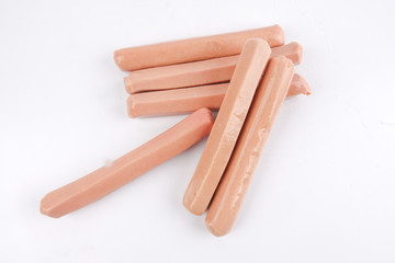 Raw meat sausages isolated on white background
