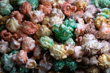 Background of caramelized popcorn. Multicolored sweet or salty.