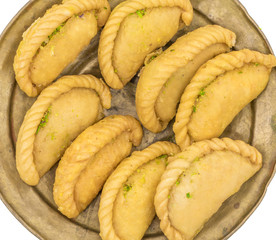 Gujiya or Gujia is a indian sweet dumpling made with suji, Maida or wheat flour and stuffed with khoya. It is common in North India, particularly in Bihar, Uttar Pradesh, Madhya Pradesh or Rajasthan