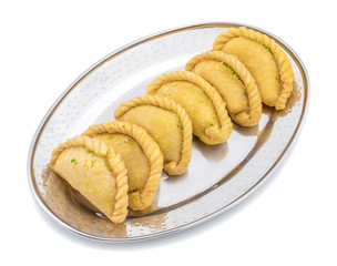 Gujiya or Gujia is a indian sweet dumpling made with suji, Maida or wheat flour and stuffed with khoya. It is common in North India, particularly in Bihar, Uttar Pradesh, Madhya Pradesh or Rajasthan