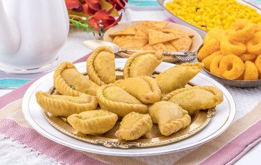 Gujiya or Gujia is a indian sweet dumpling made with suji, Maida or wheat flour and stuffed with khoya. It is common in North India, particularly in Bihar, Uttar Pradesh, Madhya Pradesh or Rajasthan
