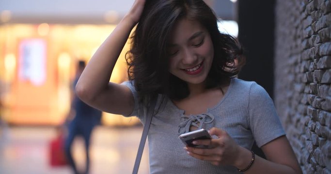 pretty woman using mobile phone in street ,4k