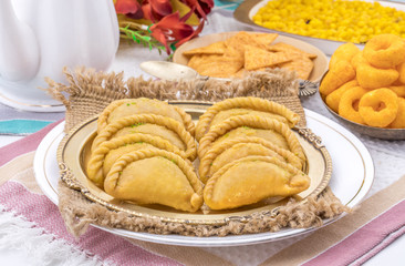 Obraz na płótnie Canvas Gujiya or Gujia is a indian sweet dumpling made with suji, Maida or wheat flour and stuffed with khoya. It is common in North India, particularly in Bihar, Uttar Pradesh, Madhya Pradesh or Rajasthan