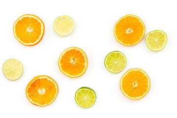 Oranges and lime round slices pattern on white background top view copy space