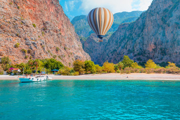 Tourists visit famous Butterfly Valley beach - Oludeniz, Turkey