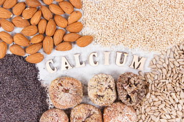 Inscription calcium and natural food containing minerals and dietary fiber, healthy nutrition concept