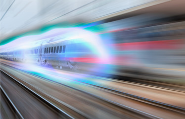 Fototapeta na wymiar White high speed train runs on rail tracks . Train in motion.