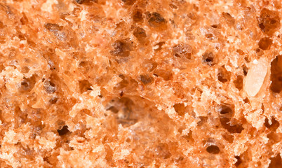 Bread with seeds and raisins as a background