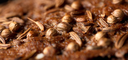 sesame seeds on black bread as a background