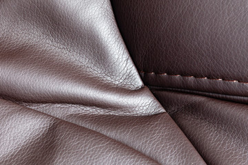 Brown leather material as an abstract background