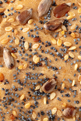 Fototapeta na wymiar Sesame with seeds and poppy seeds on bread