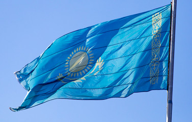 Flag of Kazakhstan against the blue sky
