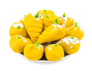 Indian Sweet Food Mango Mawa Pedha or Peda isolated on White Background