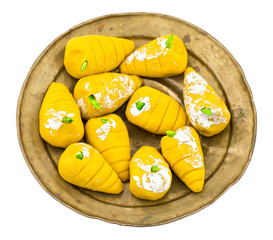 Indian Sweet Food Mango Mawa Pedha or Peda isolated on White Background