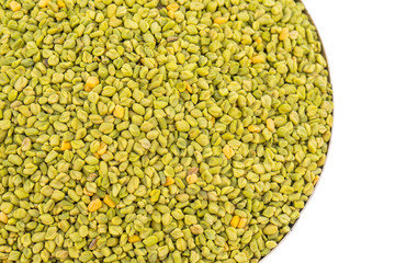 Green Fenugreek Seeds Also Know as Methi Seeds in India isolated on White Background