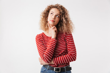 Portrait of pensive young girl with curly hair