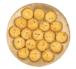 Salted Flavor Small Cumin Cookies or Biscuits Served in Plate Also Know as Nan Khatai or Jeera Cookies is a tea time Snack. Little Sweet and Little Salty isolated on White Background
