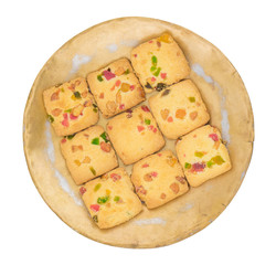 Delicious Tutti Frutti Cookies or Biscuits in Vintage Plate Also Know as Candied Fruits Cookies isolated on White Background