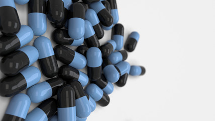 Pile of black and blue medicine capsules