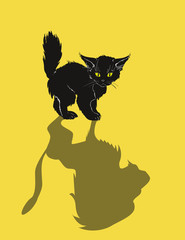 A cute black kitten and a lion's shadow, on a yellow background. Kitten dream.
