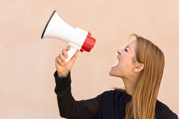 Angry woman yelling into a megaphone