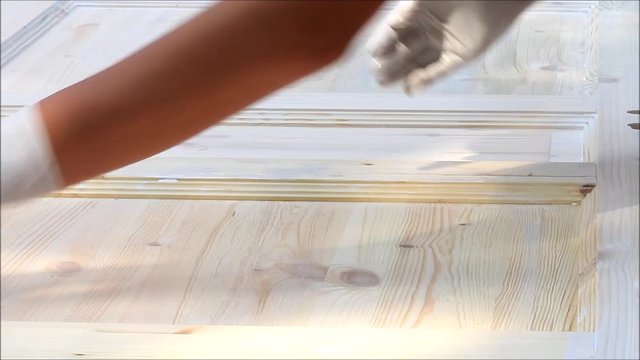 painting wooden surface with white color
