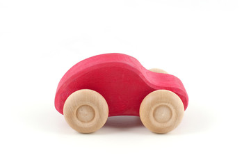 Red wooden car isolated on white background 