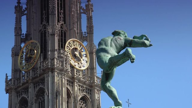 Antwerp, Belgium:The Grand Place, Grote Markt, with the Statue of Brabo, throwing the giant's hand into the Scheldt River and the Cathedral of our Lady.