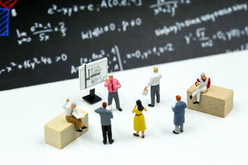 Miniature people : reading a book with teacher,Education concept.