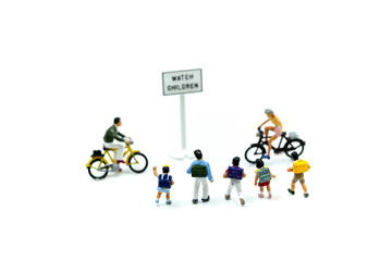 Miniature people : student or children crossing road on way to school,Back to school concept.