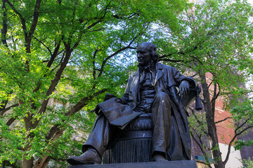 The bronze statue at City Hall Park in lower Manhattan in NYC