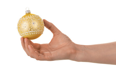 Christmas toy ball with designs and rhinestones in female hand isolated on white