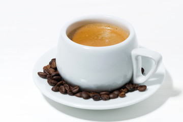 morning mug of espresso on a white background, closeup